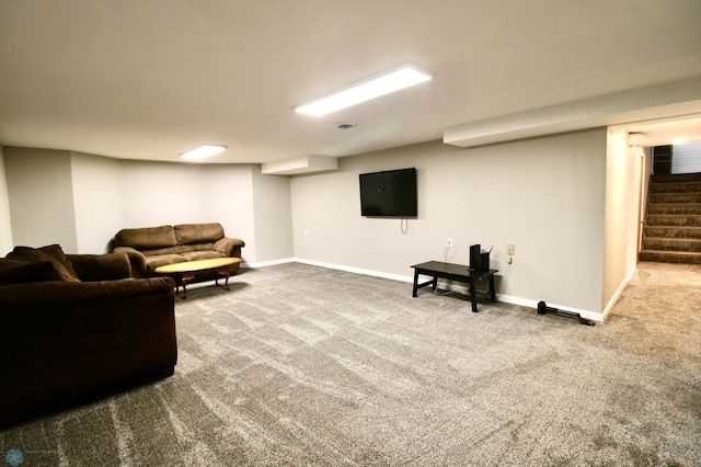 carpeted living room with baseboards and stairs