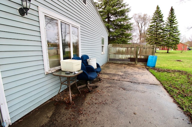 view of patio featuring fence