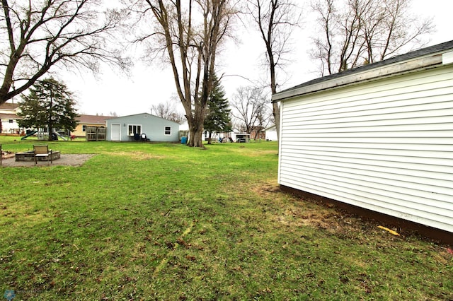 view of yard with a fire pit