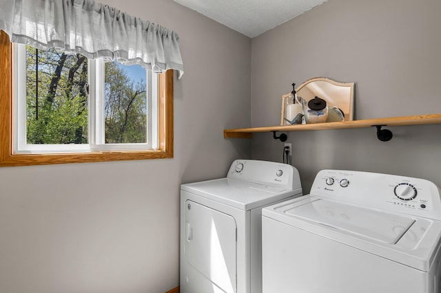 washroom featuring washer and dryer