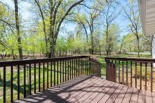 wooden terrace with a lawn