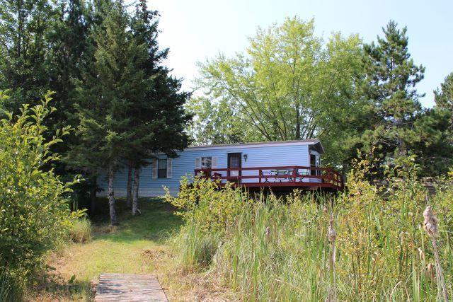 rear view of house with a wooden deck