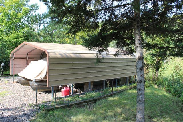 view of outbuilding featuring a carport