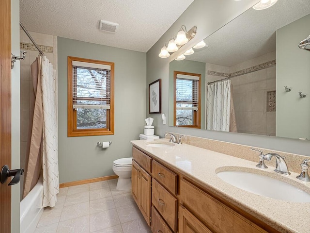 full bathroom with a sink, a wealth of natural light, and visible vents