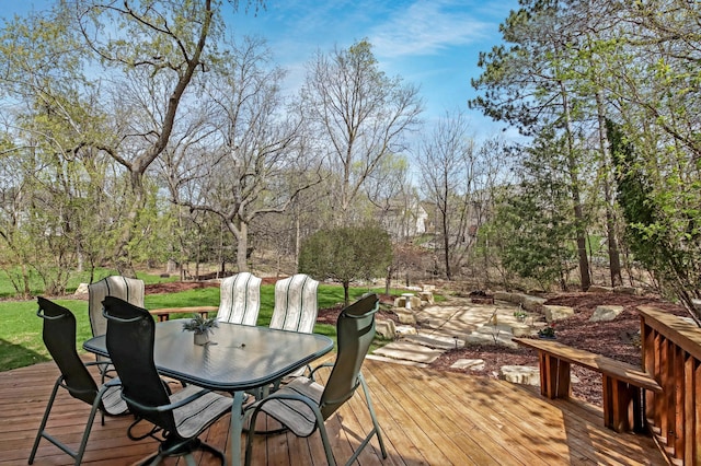 wooden terrace with outdoor dining space