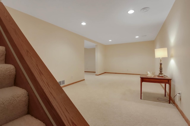 staircase with visible vents, carpet flooring, baseboards, and recessed lighting