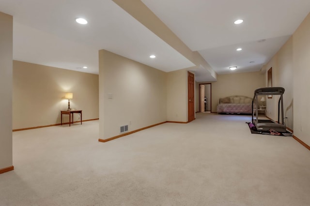workout room featuring baseboards, light carpet, recessed lighting, and visible vents
