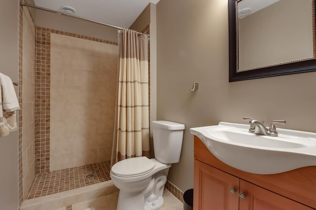 full bath featuring vanity, toilet, tile patterned flooring, and a stall shower