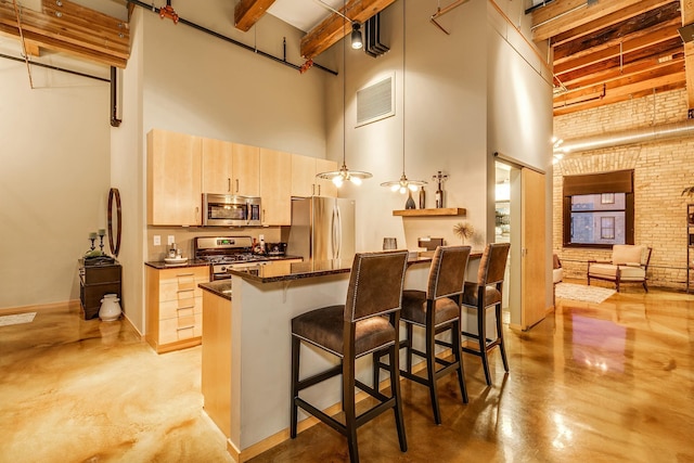 406 Wacouta St Unit 707, Saint Paul, MN 55101 - kitchen featuring stainless steel appliances, a high ceiling, visible vents, and concrete floors