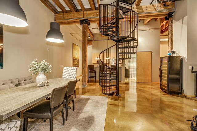 406 Wacouta St Unit 707, Saint Paul, MN 55101 - interior space with a high ceiling, beamed ceiling, concrete flooring, and stairs