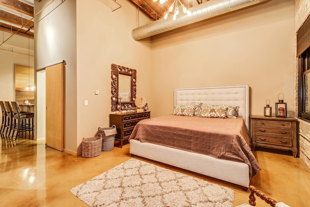 406 Wacouta St Unit 707, Saint Paul, MN 55101 - bedroom with concrete flooring, a high ceiling, and beam ceiling