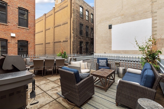 406 Wacouta St Unit 707, Saint Paul, MN 55101 - view of patio featuring an outdoor living space, outdoor dining area, and fence