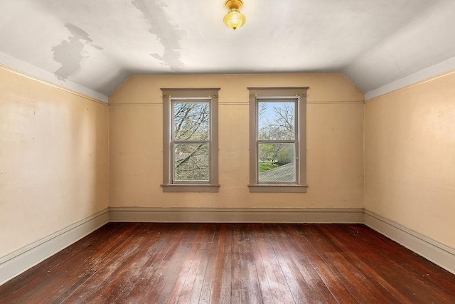 bonus room with baseboards, wood-type flooring, and lofted ceiling