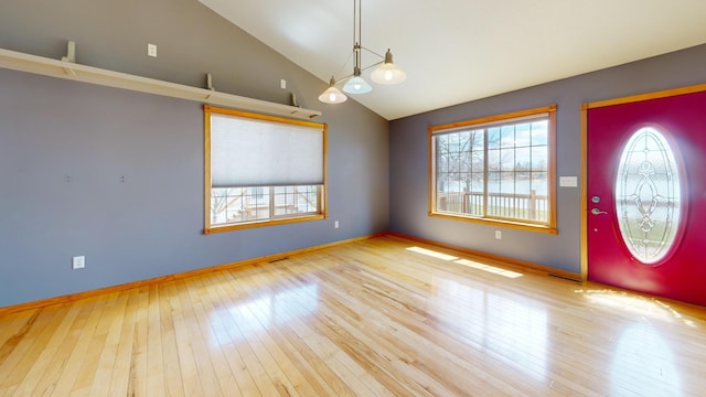11544 Lake Eunice Rd, Detroit Lakes, MN 56501 - entryway with vaulted ceiling, hardwood / wood-style flooring, and baseboards