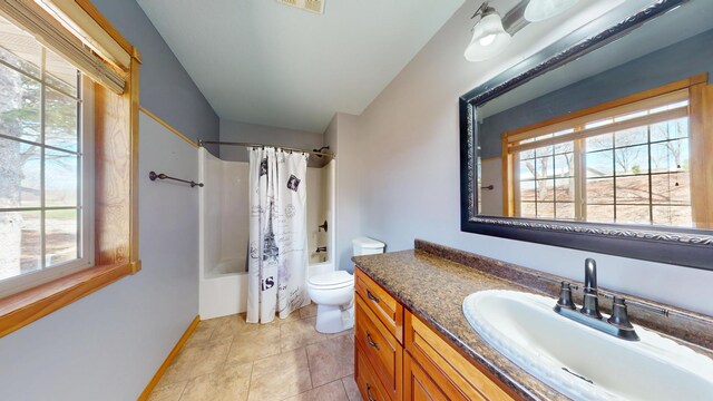 11544 Lake Eunice Rd, Detroit Lakes, MN 56501 - full bathroom featuring toilet, shower / tub combo, vanity, and baseboards