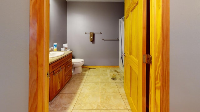 11544 Lake Eunice Rd, Detroit Lakes, MN 56501 - full bathroom featuring vanity, toilet, a shower, and tile patterned floors