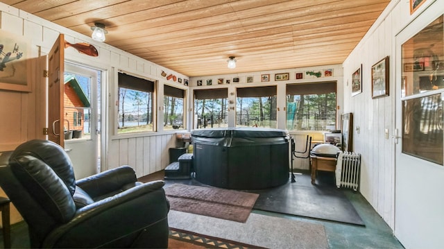 sunroom / solarium featuring radiator
