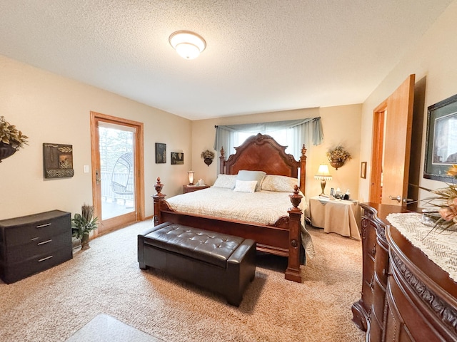 carpeted bedroom with a textured ceiling, access to exterior, and multiple windows