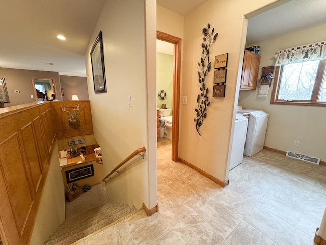 corridor with baseboards, washer and clothes dryer, recessed lighting, and visible vents