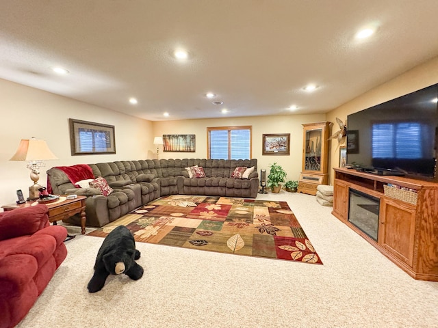 living area with recessed lighting and light carpet