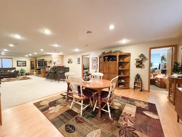 dining room featuring recessed lighting and light wood finished floors