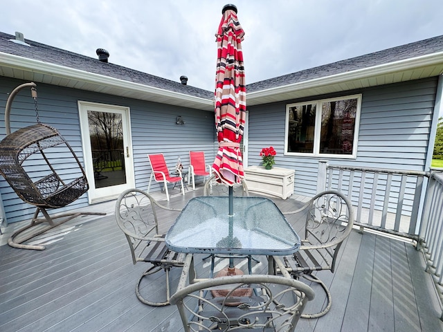 wooden terrace featuring outdoor dining area