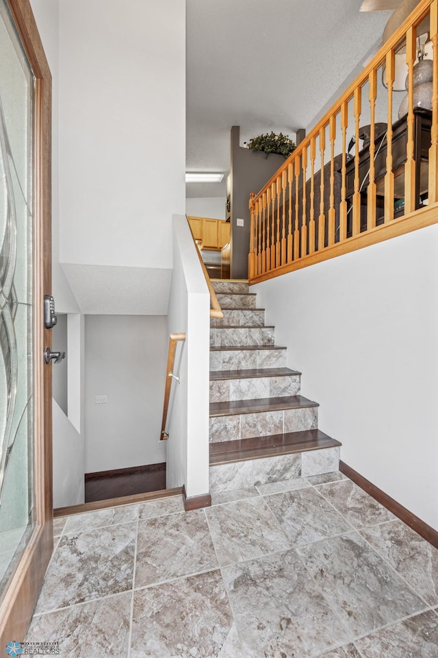 stairs featuring baseboards