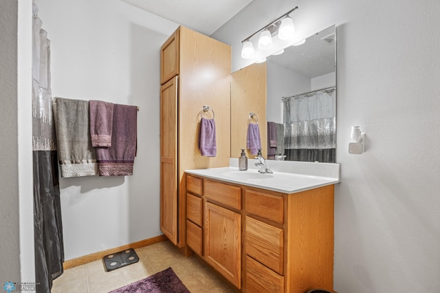 full bathroom with vanity and tile patterned flooring