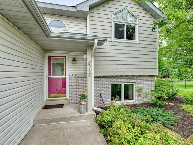 8918 Prestwick Pkwy N, Brooklyn Park, MN 55443 - property entrance featuring brick siding