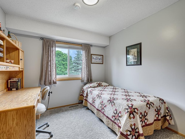 8918 Prestwick Pkwy N, Brooklyn Park, MN 55443 - bedroom featuring light colored carpet and a textured ceiling
