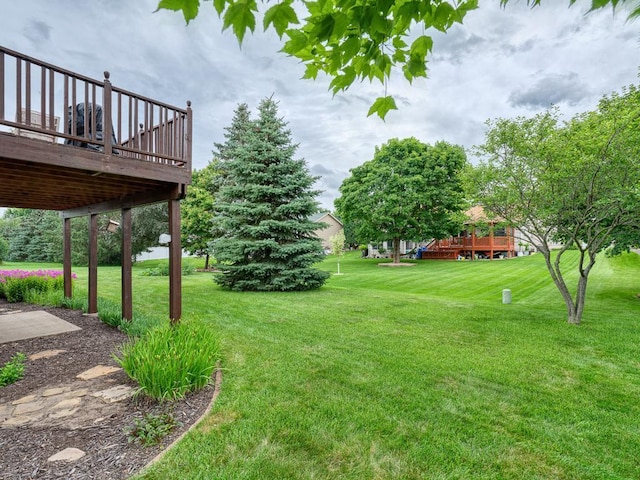 8918 Prestwick Pkwy N, Brooklyn Park, MN 55443 - view of green lawn with a wooden deck
