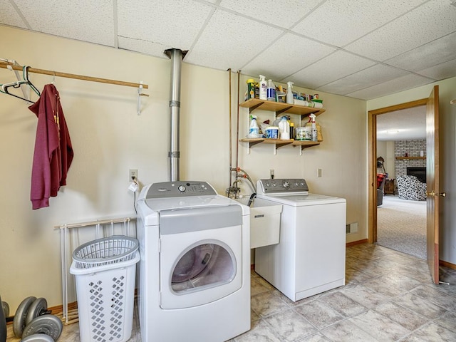 8918 Prestwick Pkwy N, Brooklyn Park, MN 55443 - laundry area featuring washing machine and dryer and baseboards