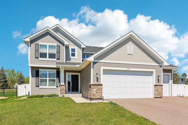 8441 152nd Ln NW, Ramsey, MN 55303 - craftsman-style home featuring stone siding, a garage, and asphalt driveway