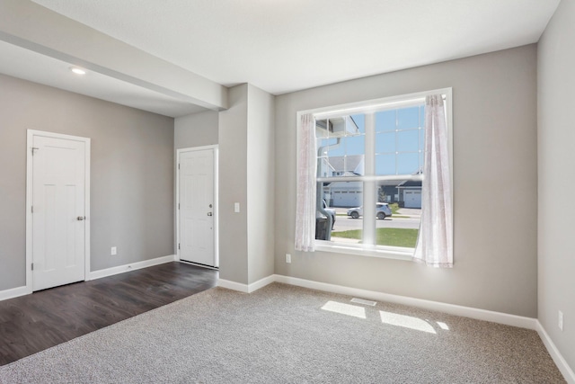 8441 152nd Ln NW, Ramsey, MN 55303 - unfurnished room with dark carpet, baseboards, and recessed lighting