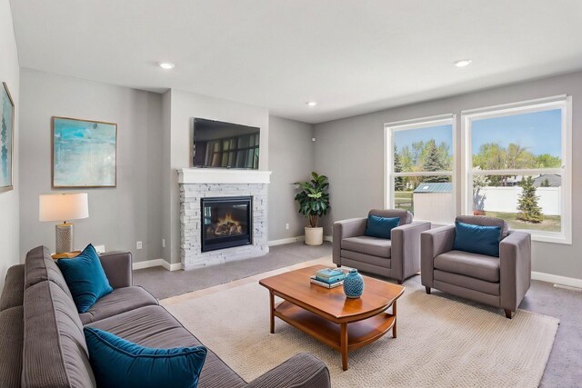 8441 152nd Ln NW, Ramsey, MN 55303 - living room featuring carpet, a stone fireplace, baseboards, and recessed lighting