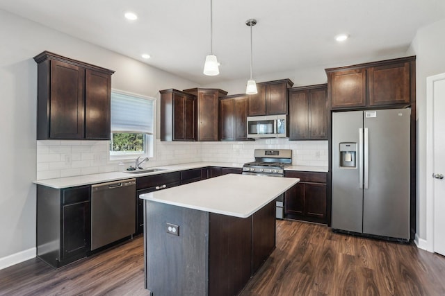 8441 152nd Ln NW, Ramsey, MN 55303 - kitchen featuring stainless steel appliances, a sink, dark brown cabinets, dark wood-type flooring, and recessed lighting