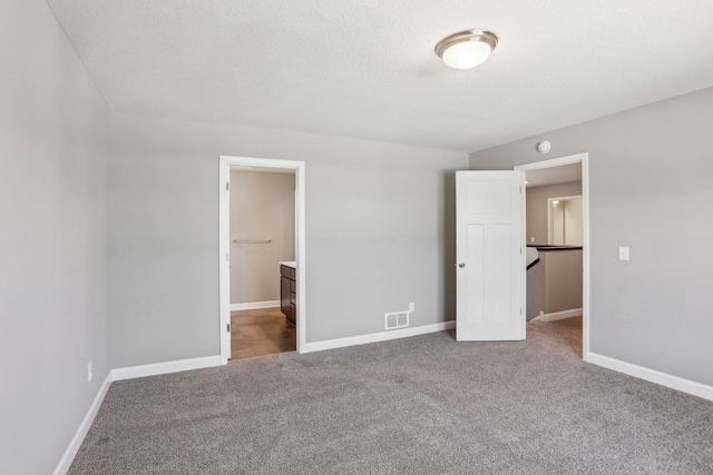 8441 152nd Ln NW, Ramsey, MN 55303 - unfurnished bedroom featuring carpet, baseboards, and ensuite bathroom