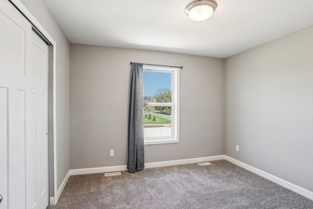 8441 152nd Ln NW, Ramsey, MN 55303 - unfurnished bedroom with carpet, baseboards, and a closet