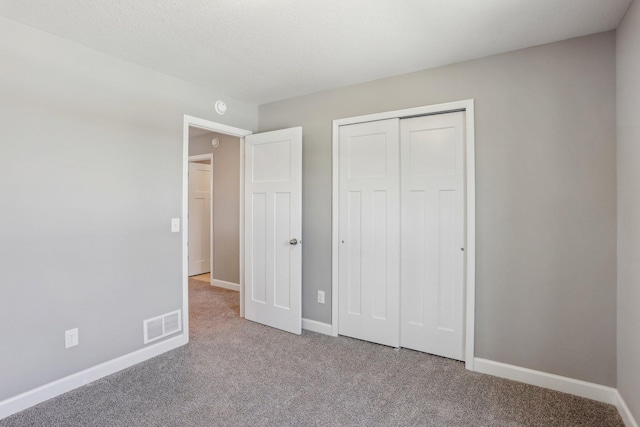 8441 152nd Ln NW, Ramsey, MN 55303 - unfurnished bedroom featuring carpet flooring, baseboards, and a closet