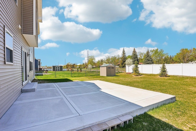 8441 152nd Ln NW, Ramsey, MN 55303 - view of yard featuring a storage unit, a patio area, and an outbuilding