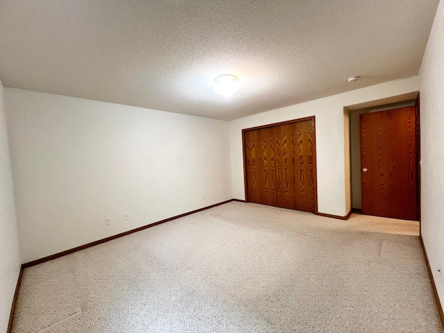 1647 8th Ave, Granite Falls, MN 56241 - unfurnished bedroom featuring baseboards, light carpet, and a closet