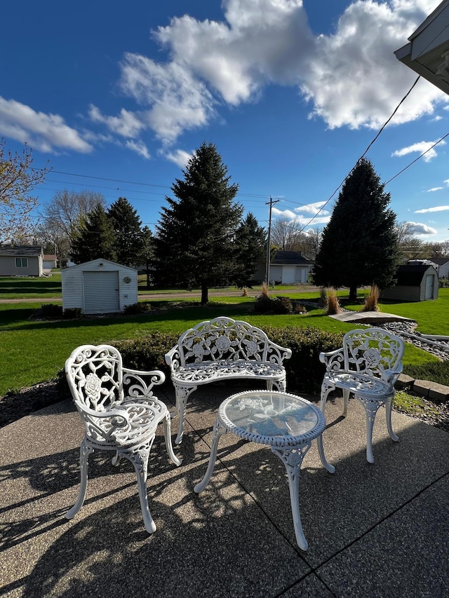 1647 8th Ave, Granite Falls, MN 56241 - view of patio / terrace featuring an outdoor structure and a shed