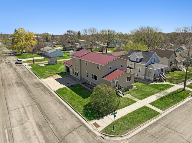 birds eye view of property with a residential view