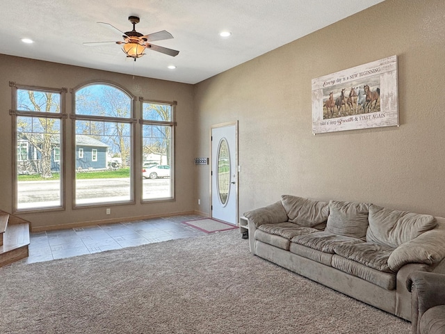 carpeted living room with tile patterned floors, baseboards, a ceiling fan, and recessed lighting