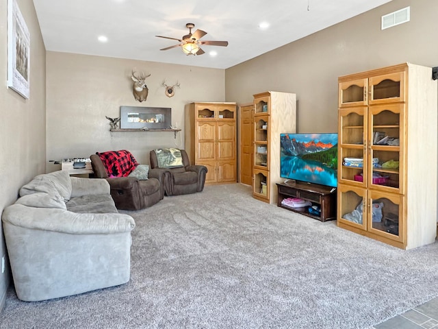 carpeted living room with a ceiling fan, recessed lighting, and visible vents