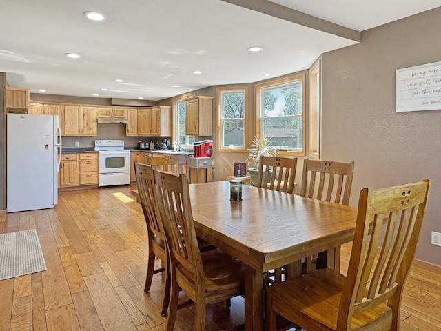 dining room featuring light wood-style floors and recessed lighting