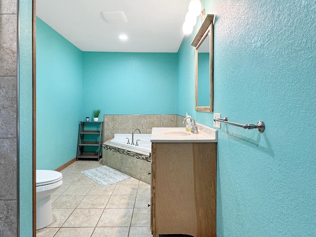 bathroom featuring vanity, toilet, tile patterned flooring, and a garden tub