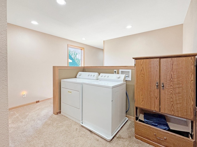 laundry room with recessed lighting, baseboards, light carpet, and washing machine and clothes dryer