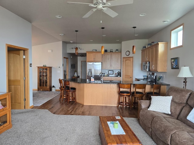living room featuring ceiling fan, dark wood-type flooring, and recessed lighting