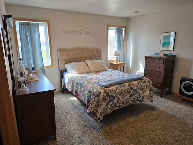 bedroom featuring carpet flooring and baseboards